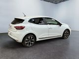 the rear end of a white car in a showroom