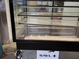an image of a refrigerated display case in a warehouse