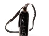 a black purse with a brown strap on a white background