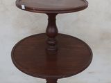 a small table with a wooden top on a sidewalk