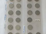 a lot of coins in a plastic bag on a table