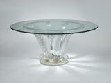 a clear glass table with a clear base and a clear glass top