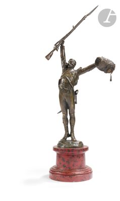 bronze statue of a man holding a baseball bat on a pedestal