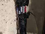 a black umbrella that has been wrapped in plastic