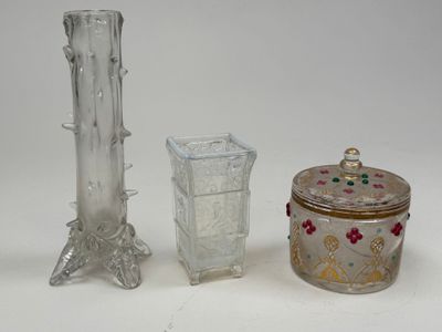 three glass vases sitting next to each other on a table