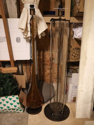 a lamp that is sitting on a stand in a room