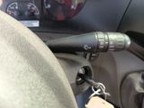 a close up of a car dashboard with a key in it