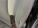 a close up of a car seat with a ruler on it
