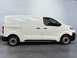 the white van is parked in a large room