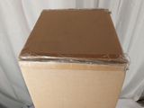 a cardboard box sitting on top of a white table