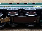 a close up of a toy train engine on the ground