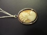 a picture of a necklace with a picture of a woman on it