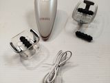 an image of an electric shaver and other accessories on a table