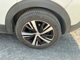 a close up of a tire on a car ' s rim