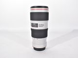 a large camera lens sitting on top of a coffee cup
