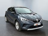 a grey renault c - cross is parked in a large room