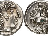 a silver coin with an image of a woman on it