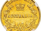 a close up of a gold coin with a crown on it