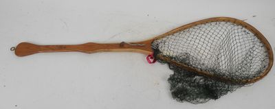 a wooden racket with a net attached to it