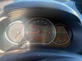 a close up of a car dashboard with a speedometer and gauges