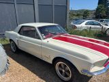 an image of a white and red car parked in front of a building