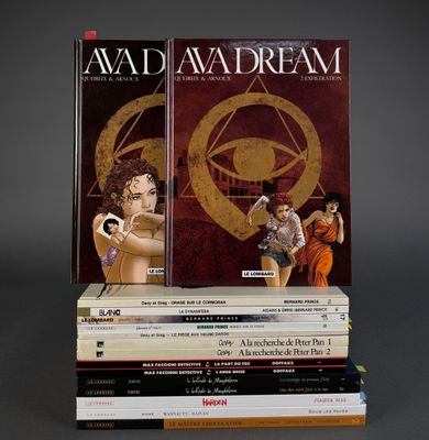 several books stacked on top of each other on a gray surface