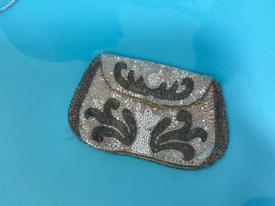 a purse that is sitting in a blue bowl