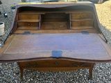 a wooden desk with a drawer on top of it