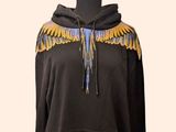 an image of a mannequin wearing a hoodie with wings on it