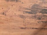 a close up of a wooden table with a clock on it