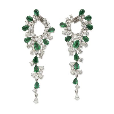a pair of emerald and diamond earrings