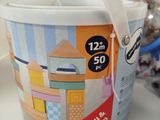 a bucket of ice cream sitting on a counter