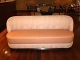 a couch that is sitting on a hard wood floor