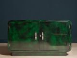 an image of a green cabinet on a wooden table