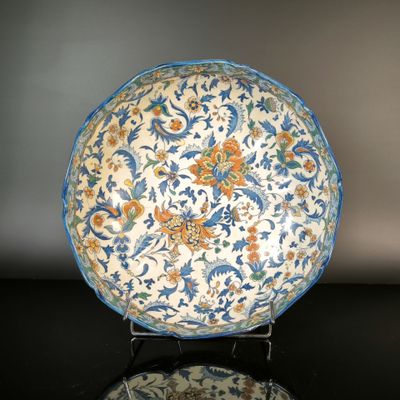 a blue and white plate with a floral design on it