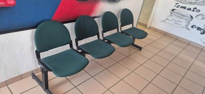 a row of chairs in a restaurant waiting for customers