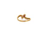 a close up of a gold ring with a diamond on it