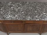 an image of a marble top sideboard in a room