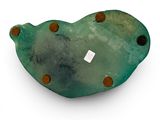 a green bird shaped object on a white surface