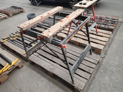 a car that is parked next to some pallets