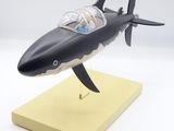 a model of a shark that is sitting on a stand