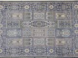 a blue and white rug with a pattern on it