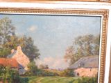 a picture of a painting of a farm scene in a gold frame