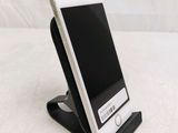 a cell phone that is sitting on a stand