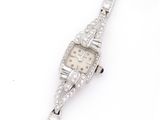 a lady ' s watch with diamonds on a white background