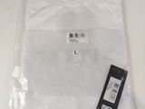a close up of a white shirt with a tag on it