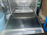 a silver oven that is inside of a kitchen