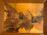 une photo d'un tableau représentant une vache dans un village