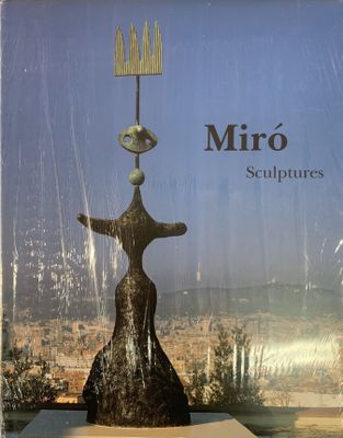 an image of a book with a statue on top of it