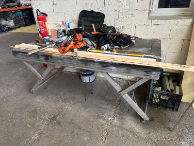 a workbench with tools on it in a garage